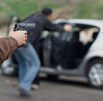 Thugs ambush a car at gunpoint