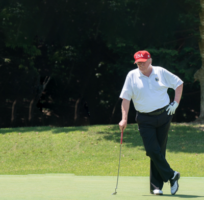 Donald Trump on the putting green at a golf course