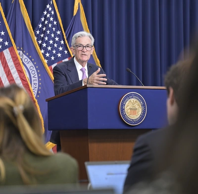 Fed Chair Jerome Powell speaks at the lectern