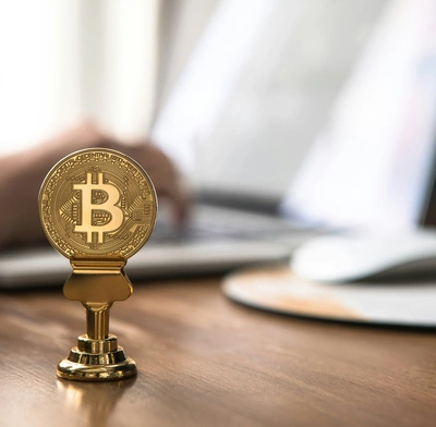 Bitcoin in front of trader's terminal
